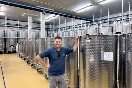 Franz-Josef Gritsch in front of his wine tanks